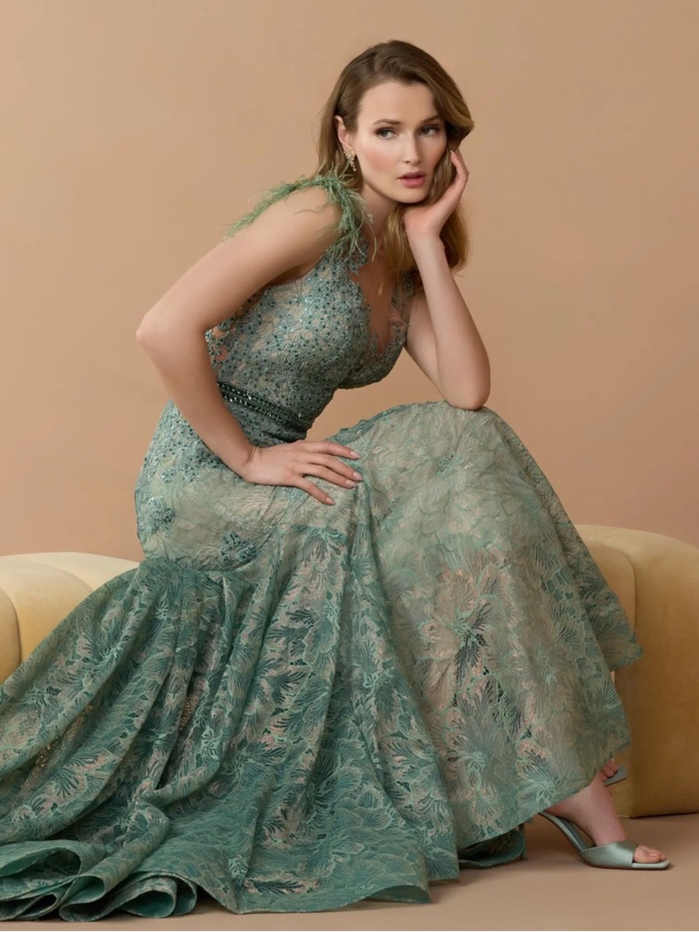 MAC DUGGAL
Green Embellished Lace High Neck Gown With Feather Sleeves